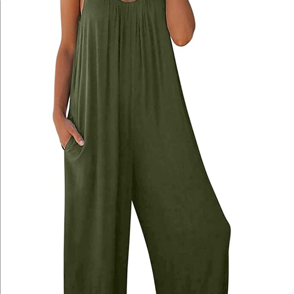 Imayondia one piece romper in gradient colors from dark blue to teal to white .
